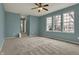 Spacious bedroom featuring plush carpeting, ample natural light, and a ceiling fan at 12027 Sellerton Dr, Fishers, IN 46037