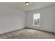 This bedroom offers plush carpeting, large window, and neutral paint at 12027 Sellerton Dr, Fishers, IN 46037