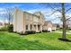 Beautifully landscaped yard surrounds a two-story brick home with a side-entry two-car garage at 12027 Sellerton Dr, Fishers, IN 46037