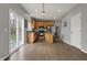 Bright kitchen features stainless steel appliances, center island, and sliding door access to the backyard at 12027 Sellerton Dr, Fishers, IN 46037