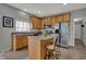 The kitchen includes a granite countertop island, wooden cabinets, and stainless steel appliances at 12027 Sellerton Dr, Fishers, IN 46037