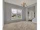 Bright living room with large windows and a view of the front yard at 12027 Sellerton Dr, Fishers, IN 46037