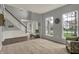 Spacious living room featuring neutral carpet, large windows, and an open floor plan at 12027 Sellerton Dr, Fishers, IN 46037
