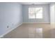 Well lit and empty bedroom features neutral walls and tiled floors at 12516 Schoolhouse Rd, Fishers, IN 46037