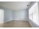 Bright living room featuring tile floors and a large window with blinds at 12516 Schoolhouse Rd, Fishers, IN 46037