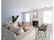 Bright living room features neutral walls, tile floors, a fireplace, and natural light at 12516 Schoolhouse Rd, Fishers, IN 46037
