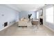 Bright living room features neutral walls, tile floors, a fireplace, and natural light at 12516 Schoolhouse Rd, Fishers, IN 46037
