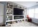 Comfortable living room features a built-in entertainment center and ample storage at 12516 Schoolhouse Rd, Fishers, IN 46037