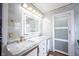 Elegant main bathroom with marble countertops, modern lighting, and sleek cabinetry at 12516 Schoolhouse Rd, Fishers, IN 46037