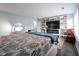 Spacious main bedroom with a cozy seating area and a custom built-in entertainment center at 12516 Schoolhouse Rd, Fishers, IN 46037