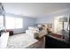 Spacious main bedroom with wood floors, a large window, and stylish furnishings at 12516 Schoolhouse Rd, Fishers, IN 46037