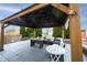 Inviting outdoor covered patio area with comfortable seating and dining options at 12516 Schoolhouse Rd, Fishers, IN 46037
