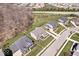 An aerial view showing the neighborhood with manicured lawns and well-maintained homes at 12598 Coastal Pl, Fishers, IN 46037