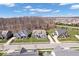 Aerial view of the neighborhood showcasing well-maintained homes, lawns and mature trees at 12598 Coastal Pl, Fishers, IN 46037
