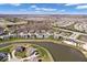 An aerial view of the community featuring ponds, well-manicured lawns, and mature trees at 12598 Coastal Pl, Fishers, IN 46037