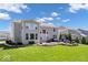 Large backyard featuring a patio, outdoor fireplace and lush lawn at 12598 Coastal Pl, Fishers, IN 46037