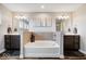 Bright bathroom featuring and sinks, a soaking tub, and wood-look flooring at 12598 Coastal Pl, Fishers, IN 46037