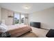 Serene bedroom with modern decor, natural light, and ample space at 12598 Coastal Pl, Fishers, IN 46037