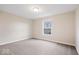 Bedroom featuring neutral walls, carpet, and a bright window at 12598 Coastal Pl, Fishers, IN 46037