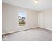 Bedroom with neutral walls, carpet flooring, and view of the front yard at 12598 Coastal Pl, Fishers, IN 46037