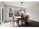 Inviting dining room with natural light and views, showcasing a stylish wooden table and chairs at 12598 Coastal Pl, Fishers, IN 46037