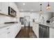 Gourmet kitchen featuring white cabinets, stainless steel appliances, and granite countertops at 12598 Coastal Pl, Fishers, IN 46037