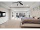 Spacious main bedroom features a tray ceiling, large windows, and comfortable seating at 12598 Coastal Pl, Fishers, IN 46037