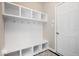 Convenient mudroom with built-in storage, coat hooks, and a bench at 12598 Coastal Pl, Fishers, IN 46037