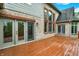 Wooden deck showing brick and siding house exterior with sliding doors for seamless indoor/outdoor living at 13758 Foxdale Lake Dr, Carmel, IN 46032