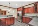 Basement kitchen featuring stainless steel appliances, countertops, and custom cabinetry at 13758 Foxdale Lake Dr, Carmel, IN 46032