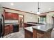 Basement wet bar with stainless steel refrigerator and dishwasher plus a wine storage room at 13758 Foxdale Lake Dr, Carmel, IN 46032