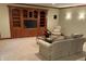 Finished basement features a large built-in entertainment center and comfortable seating area at 13758 Foxdale Lake Dr, Carmel, IN 46032