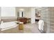 Bright bathroom features a soaking tub, glass block shower and opens to main bedroom at 13758 Foxdale Lake Dr, Carmel, IN 46032