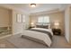 Bright bedroom with a comfortable bed, neutral tones, and ample natural light from the window at 13758 Foxdale Lake Dr, Carmel, IN 46032