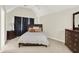 Cozy bedroom with cathedral ceilings features neutral colors and carpeted floors at 13758 Foxdale Lake Dr, Carmel, IN 46032