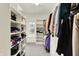 Walk-in closet with custom shelving and storage for optimal organization at 13758 Foxdale Lake Dr, Carmel, IN 46032