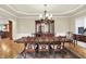 Formal dining room with hardwood floors, large buffet, and built-in cabinets for elegant entertaining at 13758 Foxdale Lake Dr, Carmel, IN 46032