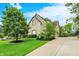 Lovely home with a well-maintained lawn and a long driveway leading to the property at 13758 Foxdale Lake Dr, Carmel, IN 46032