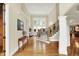 Grand foyer with hardwood floors, staircase, and ample natural light, creating a welcoming entrance at 13758 Foxdale Lake Dr, Carmel, IN 46032