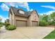 Spacious brick garage featuring two doors and a large concrete driveway with landscaping at 13758 Foxdale Lake Dr, Carmel, IN 46032