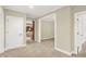 Carpeted hallway connecting multiple rooms with white trim at 13758 Foxdale Lake Dr, Carmel, IN 46032