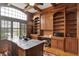 Spacious home office with built-in shelving, a large window, and a stylish desk at 13758 Foxdale Lake Dr, Carmel, IN 46032