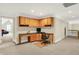 Spacious home office features a built-in wooden desk, cabinets, and a comfortable chair at 13758 Foxdale Lake Dr, Carmel, IN 46032