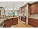 Modern kitchen featuring a brick range hood, custom cabinets and granite counters at 13758 Foxdale Lake Dr, Carmel, IN 46032