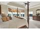 A luxurious main bedroom features a sitting area, large windows, and a four-poster bed at 13758 Foxdale Lake Dr, Carmel, IN 46032