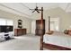 Serene main bedroom with a four-poster bed, ample closet space, and a tray ceiling at 13758 Foxdale Lake Dr, Carmel, IN 46032