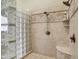 Spacious shower featuring glass block, tile surround and dual shower heads at 13758 Foxdale Lake Dr, Carmel, IN 46032