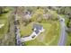 Charming aerial view of a home featuring a well maintained lawn, long driveway and two-car garage at 138 Fairway Dr, Indianapolis, IN 46260