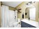 Updated bathroom with modern fixtures and a shower and bathtub combination at 138 Fairway Dr, Indianapolis, IN 46260