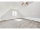 Sunlit bedroom with pitched ceiling and neutral carpet offers a bright, inviting space at 138 Fairway Dr, Indianapolis, IN 46260